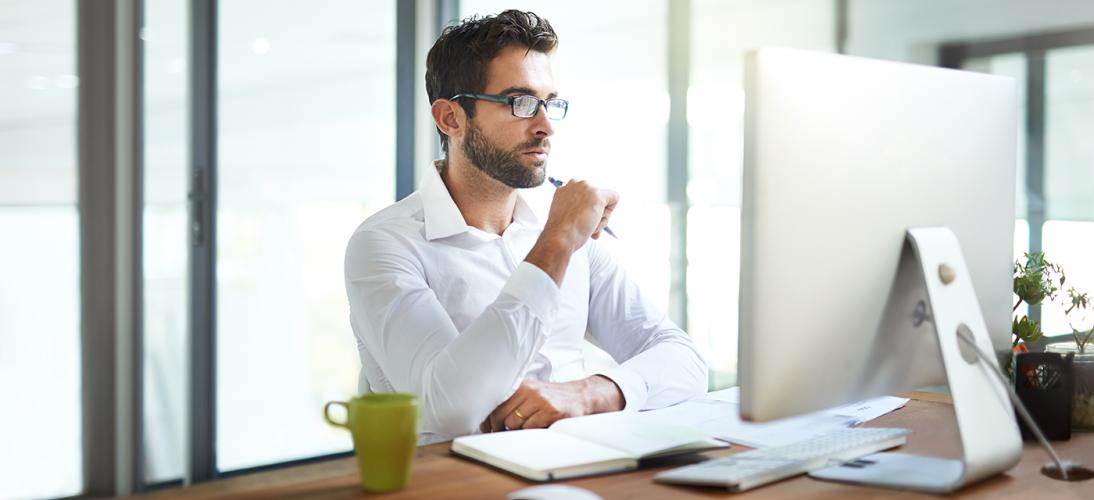 picture of a man looking at a computer