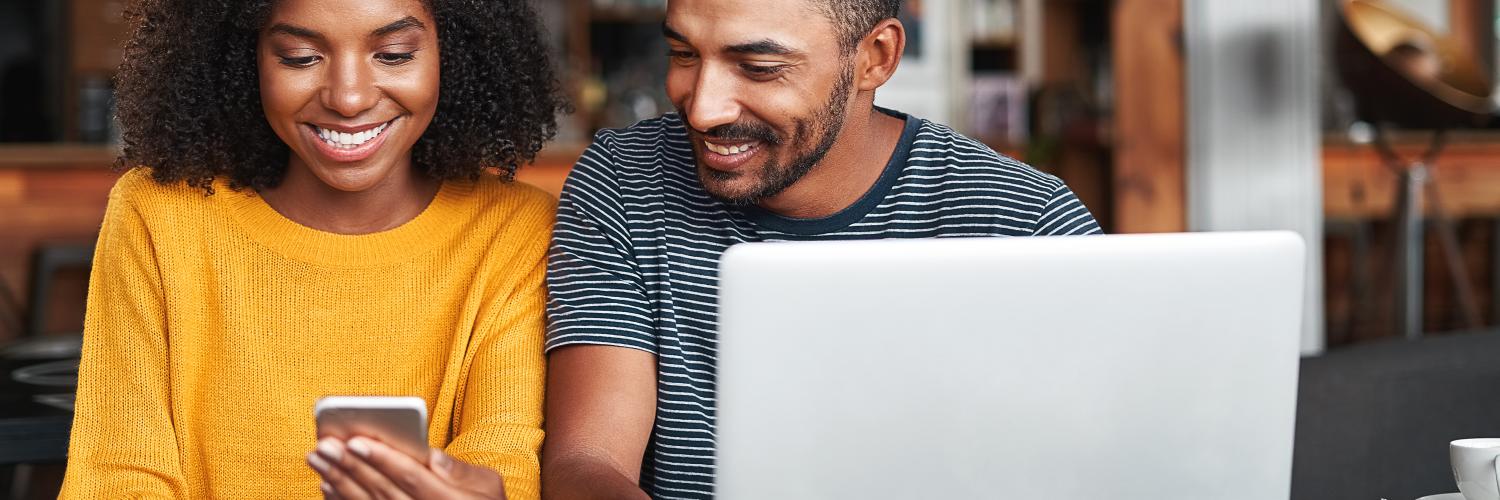 man and woman looking at their phone