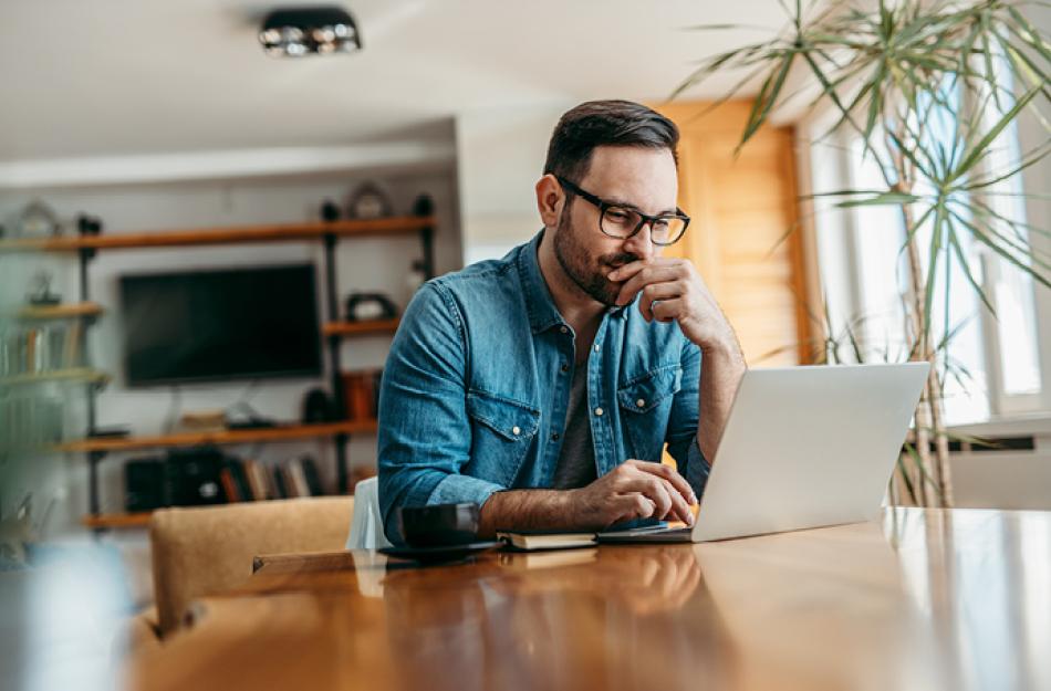 picture of a man looking at a computer