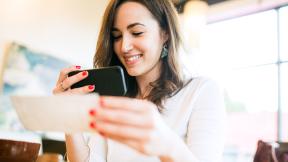 Person making a mobile deposit with their phone. 