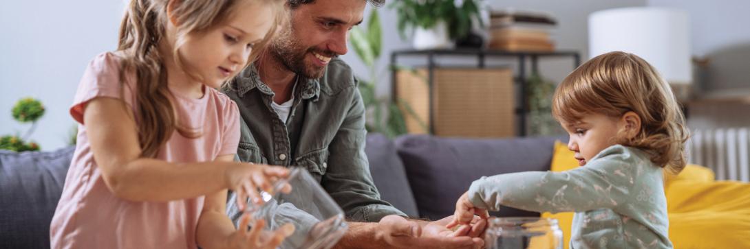 father and kids counting coins