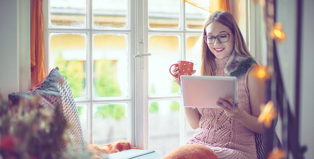 woman looking at her tablet